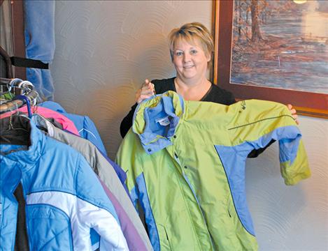 At American’s Best Value Port Polson Inn, Anne Engebretson collects and distributes children’s coats to kids who need them.