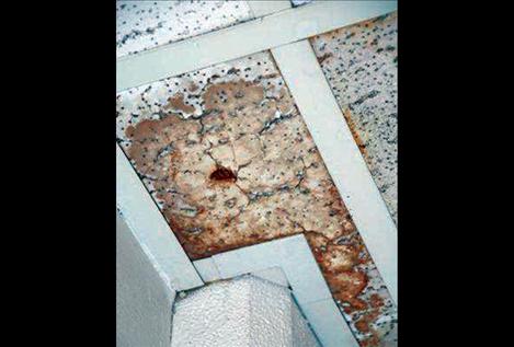 Leaks show in the porous ceiling material at Polson High School. Rainy weather in the spring of 2012 caused leaks in the school’s roof and  torrents of water running down walls in the interior of the building.