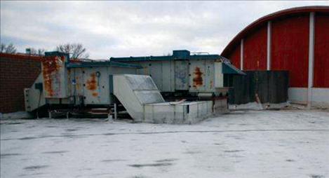 Heating units on the roof of Polson High School show rusted areas and must be removed before the roof can be replaced.