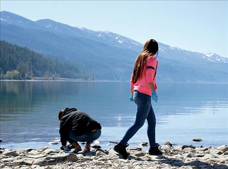 Students scour the Blue Bay shoreline last April for evidence of mussels. None was found.