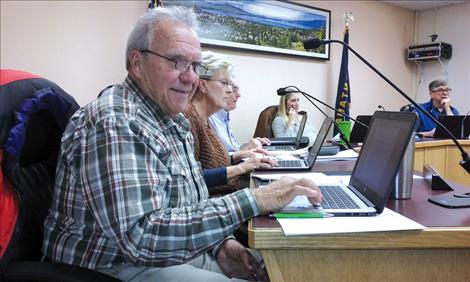 Commissioner Lou Marchello checks out his new Chromebook during the Nov. 21 Polson City Commission meeting.