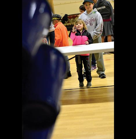 Ariana McCaughan, 5, hits the target.