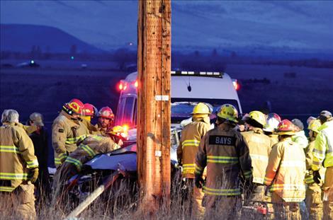 Emergency crews work to free the victim.