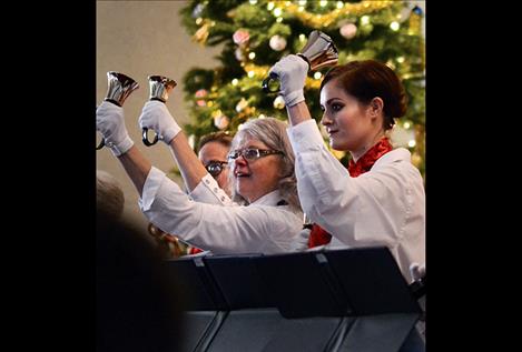 Copeland Memorial Ringers Joyce Kackmann, left, and Lindsay Castrillo play handbells.