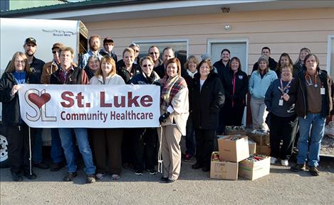 Employees from St. Luke Community Healthcare deliver 2,700 pounds of food to local food pantries.