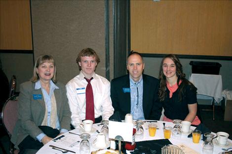 State Sen. Janna Taylor, Lake County 4-H member Rafe Fangsrud, State Rep. Greg Hertz and 4-H member Alanna Carlson visit in Helena recently.