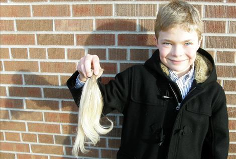 Ethan McCauley grew his hair for two years and donated 11 inches of hair to Locks of Love earlier this month.