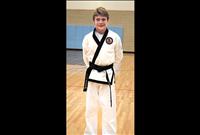 Ethan McCauley earns Black Belt in karate