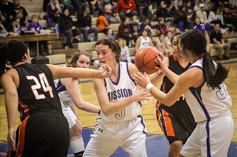 Lady Bulldog Afton Brander battles for a loose ball.