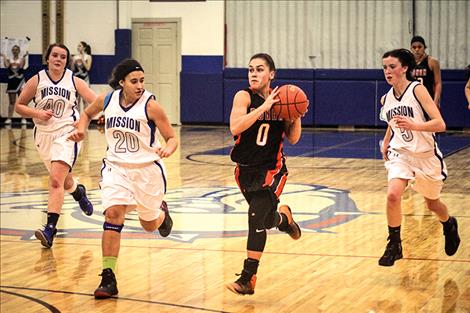 Maidens’ Micalann McCrea prepares to pass the ball during the Ronan-Mission game Friday night.