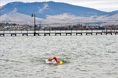 Ramon Mercado swims in the 46 degree water of Flathead Lake.