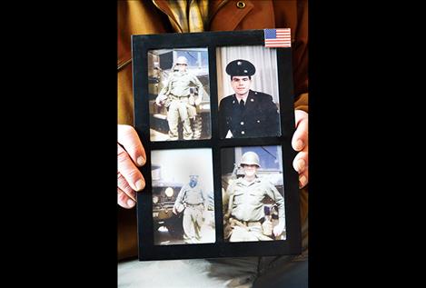 David Peck holds photos from when he served in the Army.