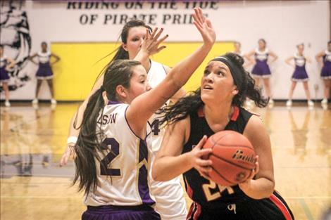 Maiden’s Alicia Camel drives the lane for a score.