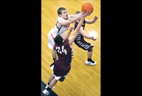 Senior Carston Baertsch pulls down a rebound Friday night.