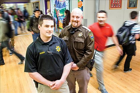 Polson High graduates Brian Hines, left, and Nate Lundeen keep halls safe as School Resource Officers.