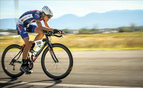 Gabriel Shipley, 14, rides the bike portion of the Polson Triathlon for Team Shipdauer on Aug. 20, 2016.