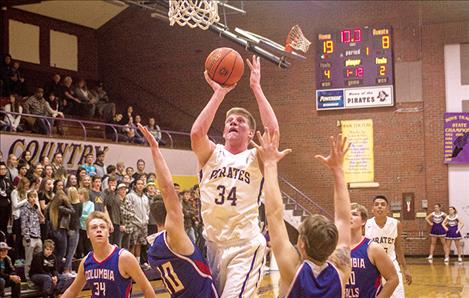 ROB ZOLMAN/VALLEY JOURNAL Pirates’ Matthew Rensvold drives the paint for a score against the Wildcats.