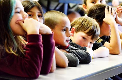 Students listen to poems.