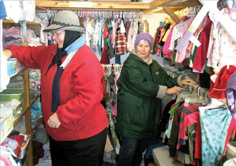 Volunteers arrange donations at the clothing donation building, also known as the Community of Proctor Exchange or COPE.
