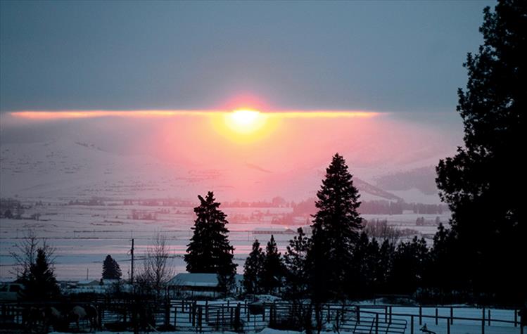 Sunlight peeks through winter haze