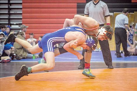 Ronan Chiefs’ Hunter Peterson takes down a Columbia Falls opponent during Western Montana Duals at the Ronan Event Center Jan. 7. Peterson won an individual title during the Ted Kato Invitational in Thompson Falls on Saturday.