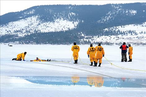 Polson Rural Fire Department volunteer firefighters train for ice rescues in Big Arm.