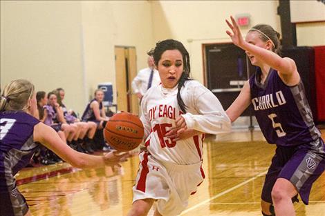 Two Eagle’s Naomi Stevens slips past Lady Vikings’ defense