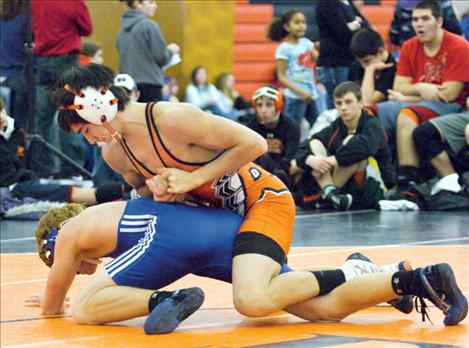 Ronan’s Brandon Dumont forces an opponent to the floor during the Western Montana Duals held earlier this season in Ronan. Dumont is the 135-pound Western B-C champion after last weekend’s divisional meet.