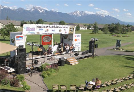 People gather near the Writer's Night stage at Mission Mountain Golf Course during last year's concert.