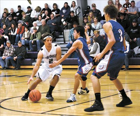 Senior Tra Ludeman drives to the hoop amidst heavy traffic.The Vikings have about a week before the district tournament in Ronan and are healing from a bout with the flu, according to coach Mike Brown.