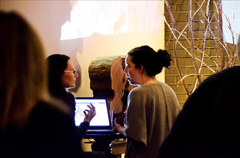 Nicole Jarvis of Ploughshare Farm in Moiese, left, speaks with people at the Pitchfest in Missoula. Her $6,000 loan for a seeding project was crowdfunded at the event.