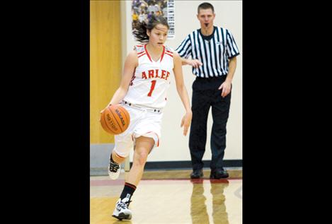 Junior Whitney Malatare heads down the court.