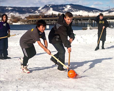 Children enjoy a game of broomball during WinterFest in Polson.