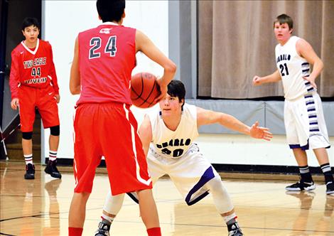 Charlo Viking Zane Haflinger defends the paint during a December 2016 home game against Two Eagle River.