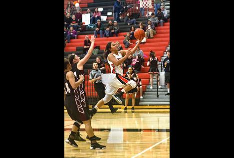 Maidens’ Lee Camel flies to the hoop for a score.