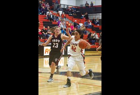 Maidens’ Lee Camel dribbles past defender during a home game Feb. 10.