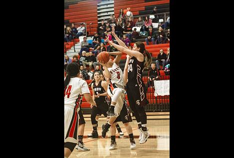 Maidens’ Micalann McCrea drives the lane during a home game Feb. 10.