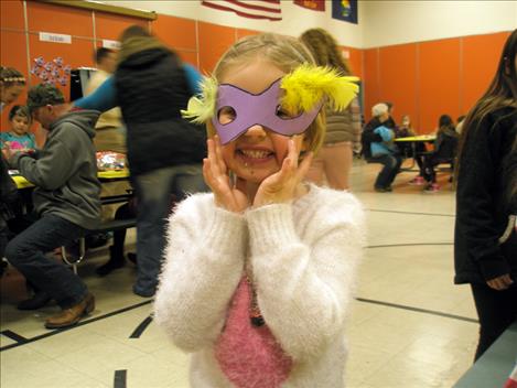 Preschooler Emily Simonich holds a mask she made at Linderman Elementary last week.