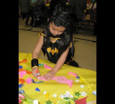 Preschooler Liliwai Borreta came to Super Family Literacy Night as batgirl.  