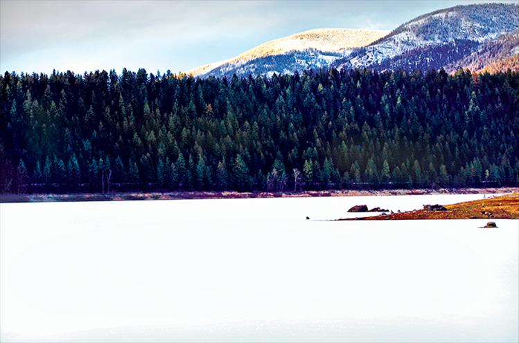 Snow covers the Mission Reservoir