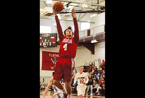 Arlee Warrior Phillip Malatare drives toward the basket.