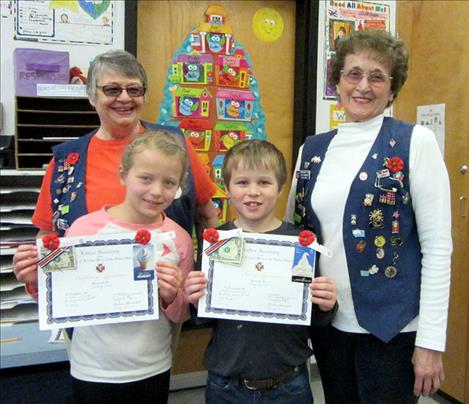 In the front row are Aubrey Krell and Kilby DuMont. In the back row are Helen Sorenson, Poppy Chairman and Margaret Fay, Ronan VFW Auxiliary President.