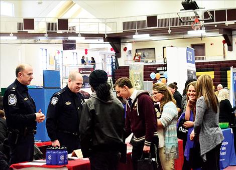 Great Falls Chief of Staff for Homeland Security Ken Huber and Assistant Area Port Director Bret C. Corneliusen talk to people about jobs in their fields.