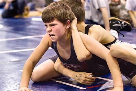 Little grapplers show off their best game faces.