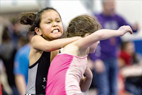 Little grapplers show off their best game faces.