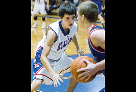 Bulldog senior Paden Alexander guards a Bigfork player at home Jan. 26. Alexander is one of three seniors on the Bulldog squad this year and an outstanding player, according to head coach Steve Pelletier.