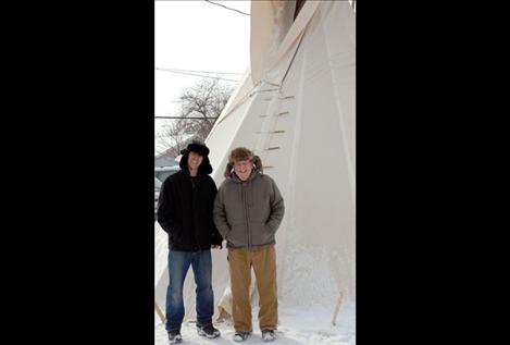 Mountain men Pastor John Payne, right, and Eric Donovan stand outside the teepee during the 2011 fundraiser.