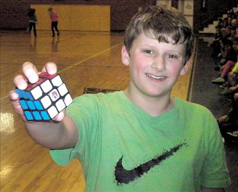 Fourth-grader Astin Brown solved a Rubik’s Cube within a minute. Brown said his personal record is 20 seconds.