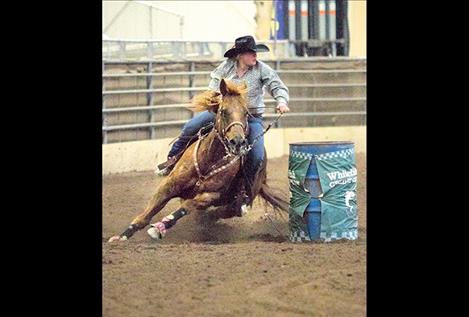 Hallie Sohr competes in the barrel racing event.