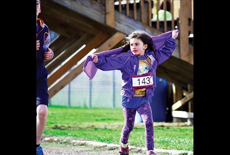 Kena Sutton, 7, runs the 1-mile fun run